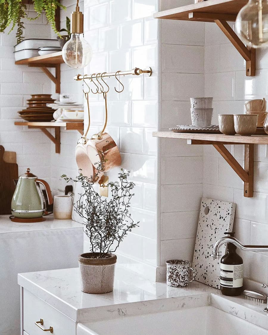 white kitchen with oak shelves for styling