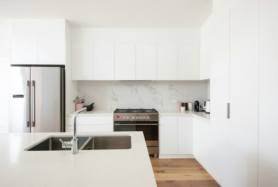 white kitchen cabinet over white kitchen counter