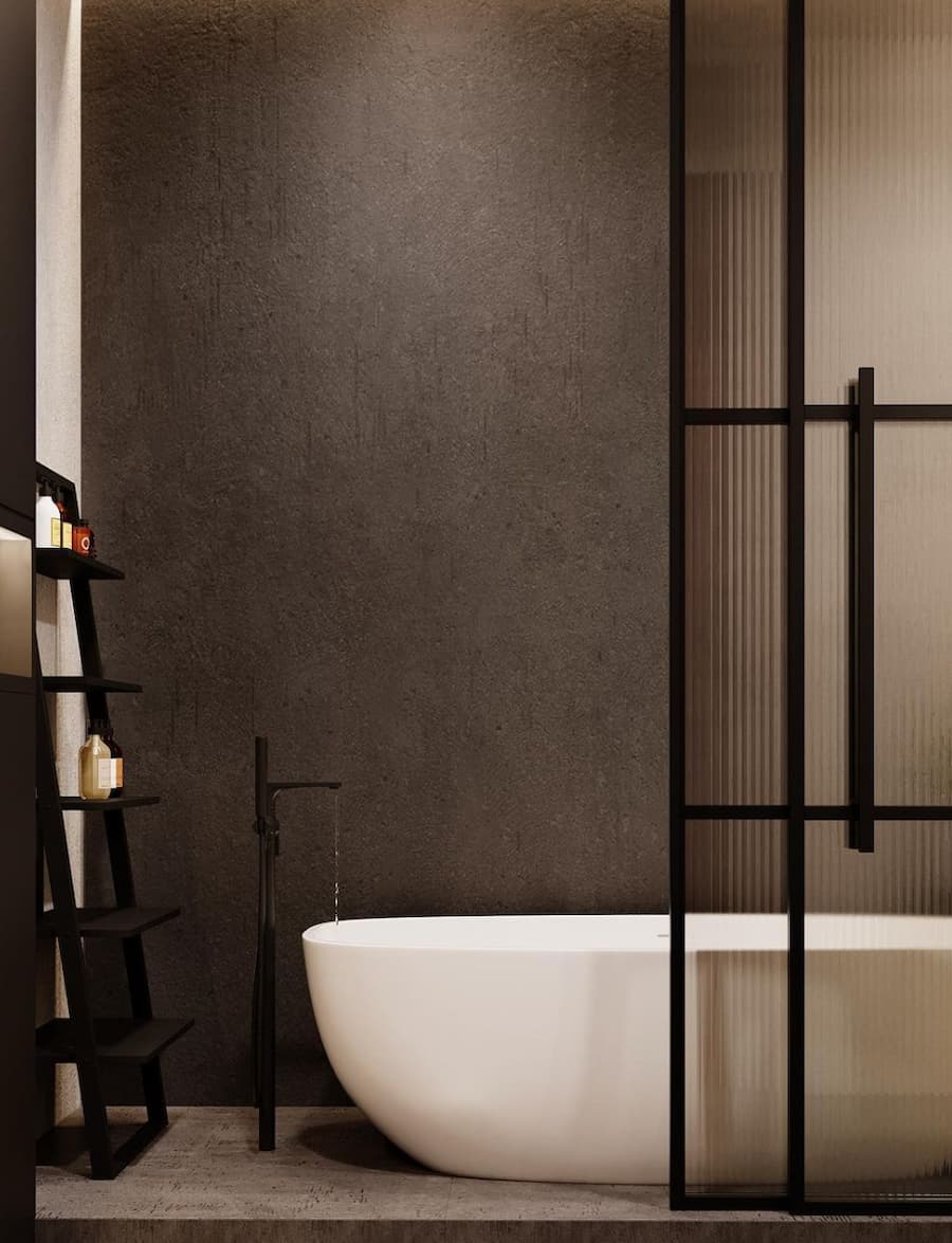 modern bathroom with free-standing bath, tall black tap and glass partition door