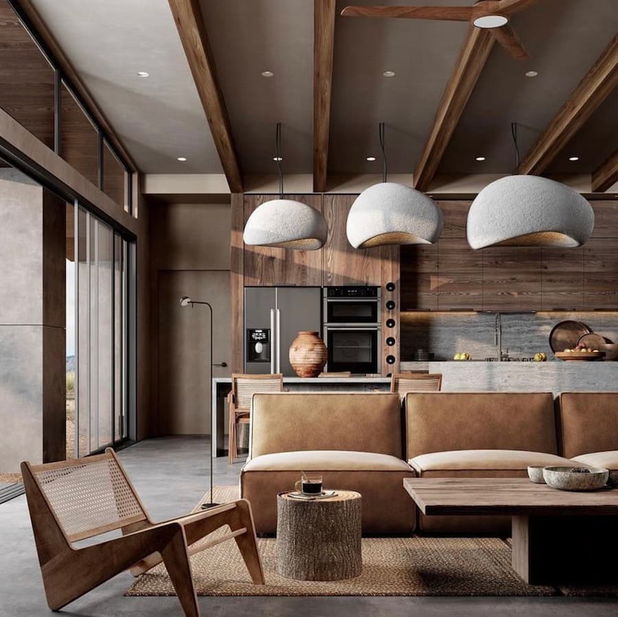 open plan living space in tones of brown, with the kitchen-diner in the background and the living space to the front