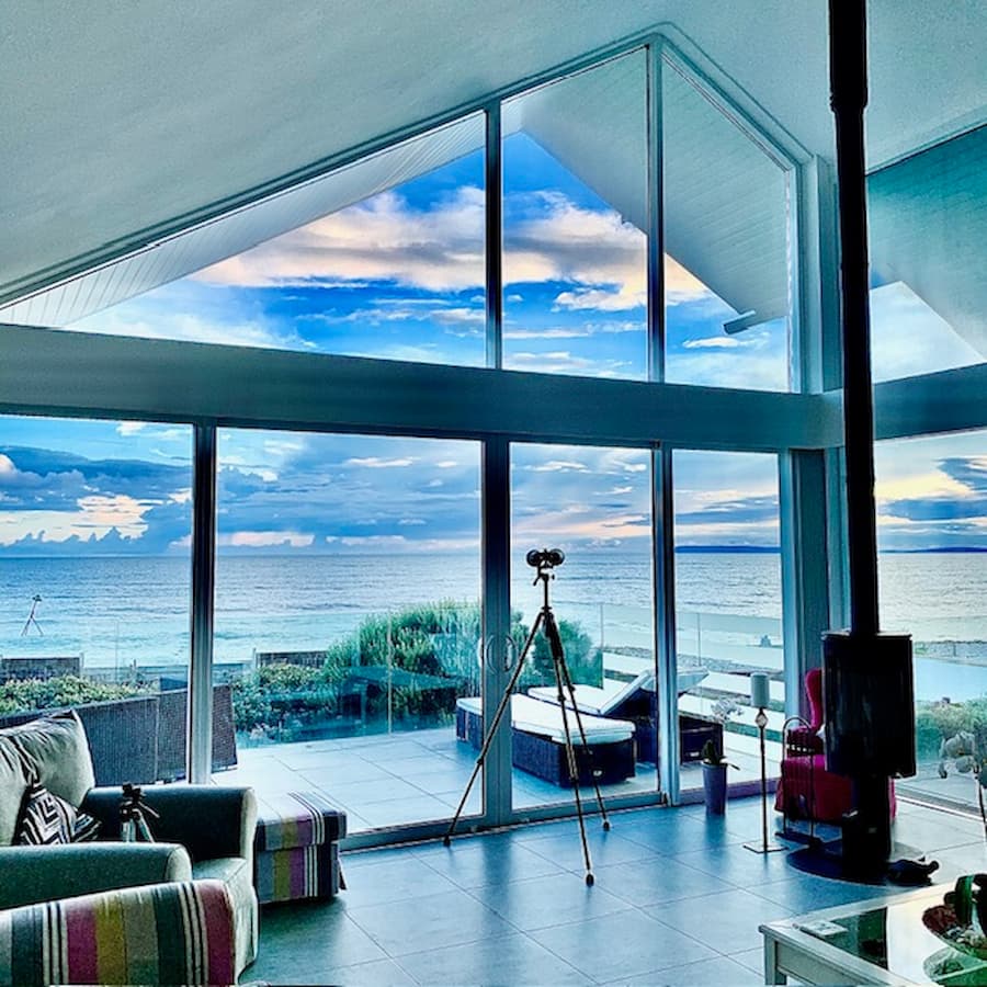 Sea views, the living room with full length windows looking out to sea