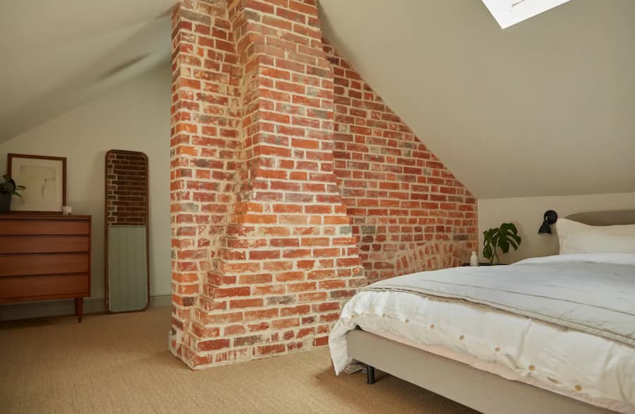Original exposed red brick work in the bedroom