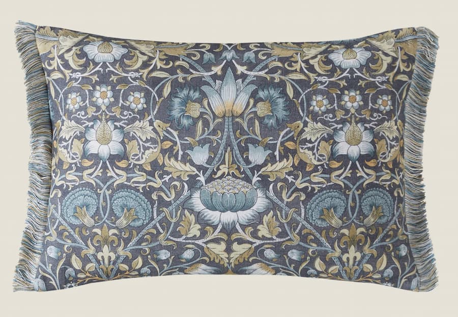 Floral designed bolster cushion in shades of blue