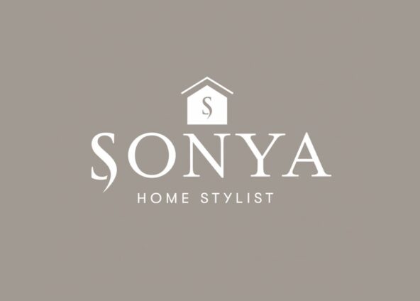 The logo has a mushroom brown background. The word Sonya is written in a larger font in white colour. The word Home Stylist is written in a smaller font size in white colour below Sonya. Above the word Sonya is a small house icon with a letter S inside it, the house is white and the letter S is mushroom brown colour.
